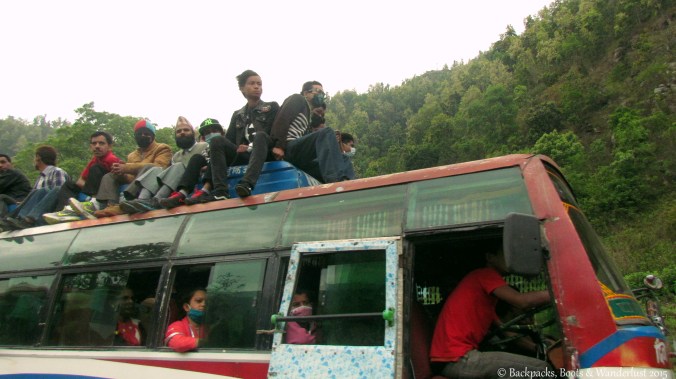 Desperate locals taking to the roofs of buses to flee Kathmandu